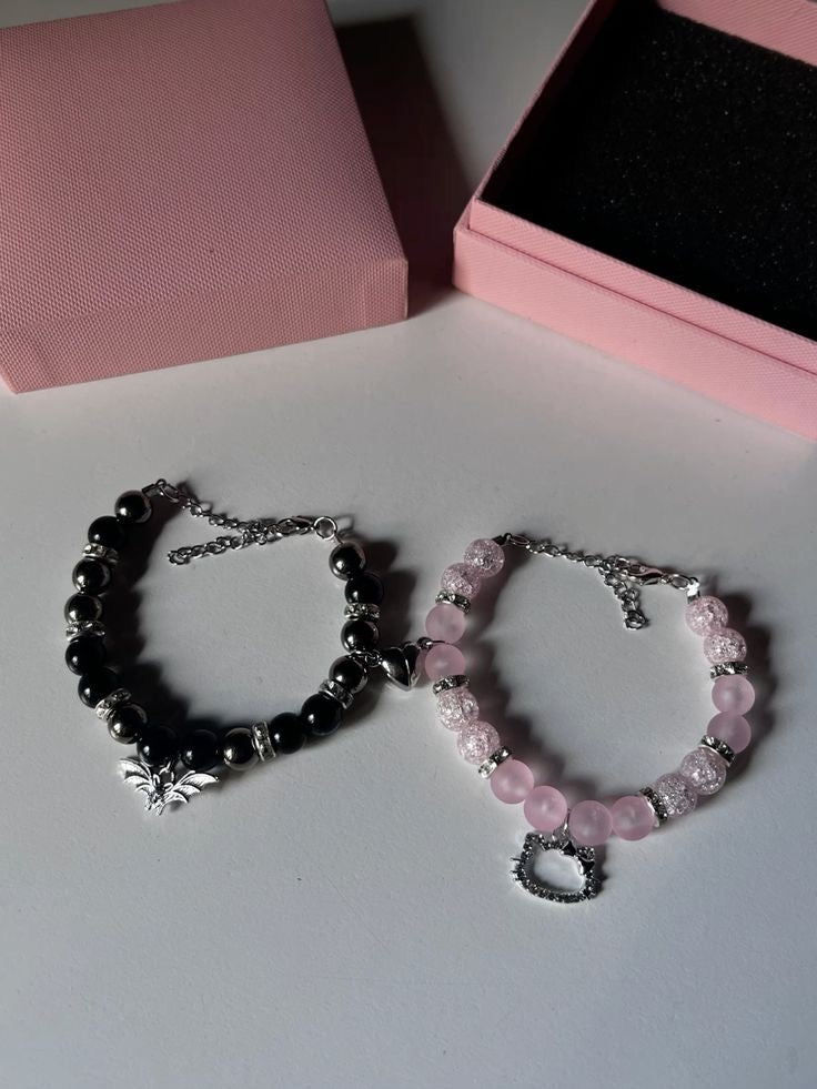 Batman and Hello Kitty bracelet set flat lay