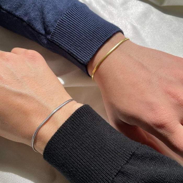 Snake chain bracelet set – gold and silver flat lay